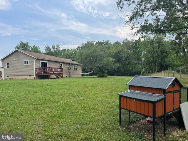 633 Ridge View Ln, Shenandoah, VA 22849 - view of green lawn with an outdoor structure and a wooden deck