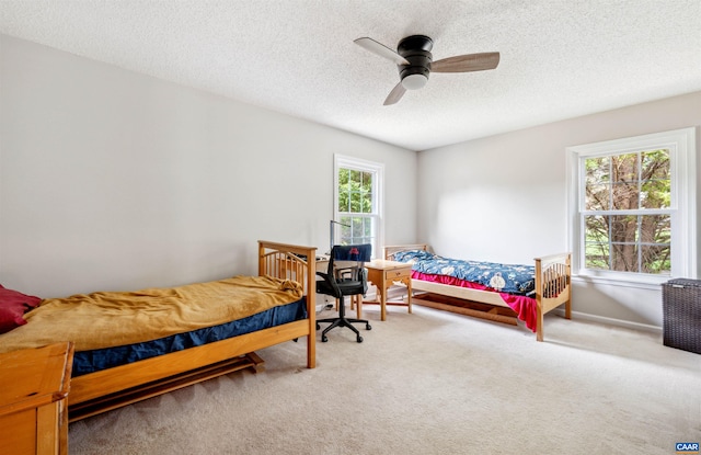 3340 Meadowfield Ln, Charlottesville, VA 22911 - carpeted bedroom with a textured ceiling and a ceiling fan