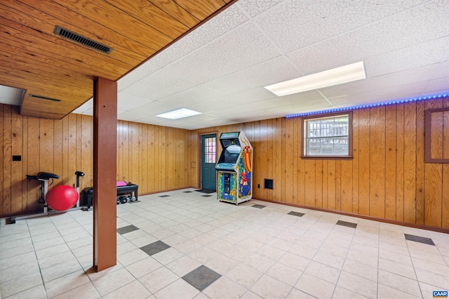 3340 Meadowfield Ln, Charlottesville, VA 22911 - basement featuring wooden walls, a paneled ceiling, and baseboards