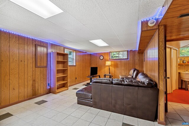 3340 Meadowfield Ln, Charlottesville, VA 22911 - living area with wooden walls, baseboards, and tile patterned flooring