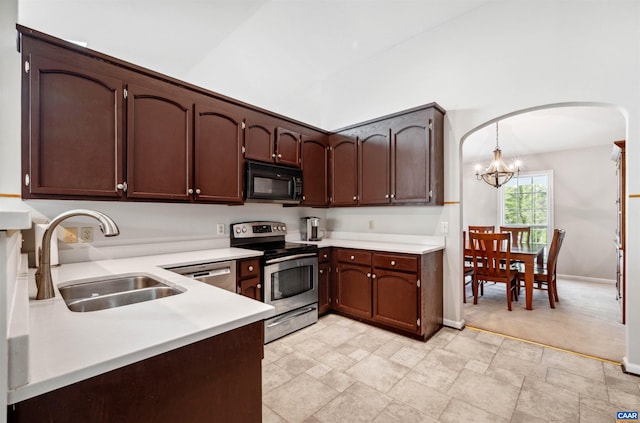3340 Meadowfield Ln, Charlottesville, VA 22911 - kitchen with stainless steel range with electric cooktop, black microwave, a sink, arched walkways, and light countertops
