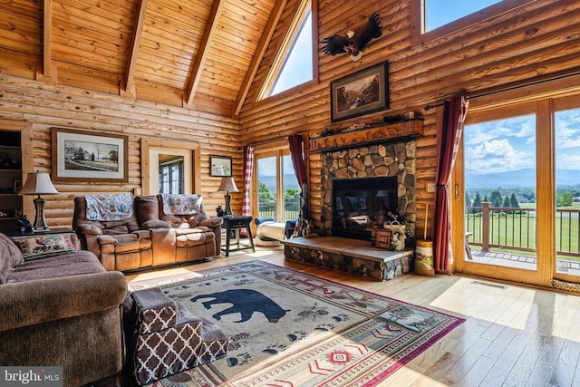 120 Wildflower Ln, Luray, VA 22835 - living room with high vaulted ceiling, log walls, hardwood / wood-style flooring, wooden ceiling with exposed beams, and a stone fireplace