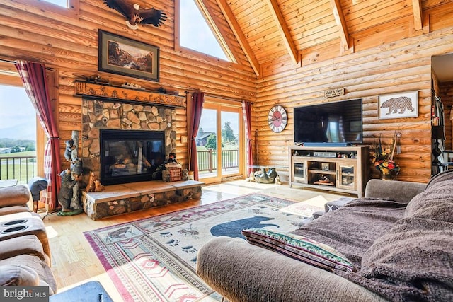 120 Wildflower Ln, Luray, VA 22835 - living area with a fireplace, wood-type flooring, wooden ceiling with exposed beams, high vaulted ceiling, and rustic walls