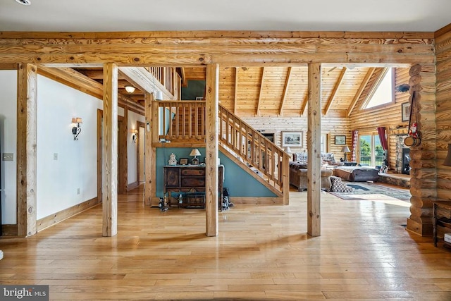 120 Wildflower Ln, Luray, VA 22835 - stairway with hardwood / wood-style flooring, log walls, high vaulted ceiling, and wooden ceiling with exposed beams