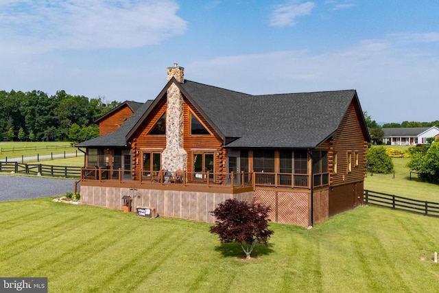 120 Wildflower Ln, Luray, VA 22835 - rear view of property with log exterior, a sunroom, a chimney, and roof with shingles