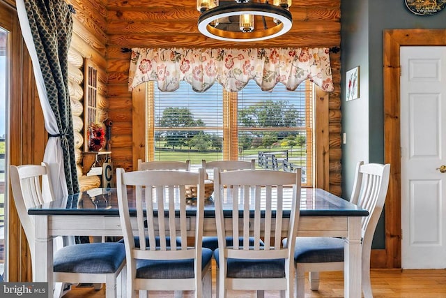 120 Wildflower Ln, Luray, VA 22835 - dining area with rustic walls, wood finished floors, and a chandelier