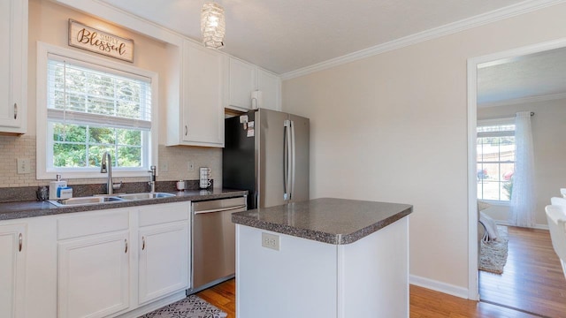 1411 Shenstone Dr, Harrisonburg, VA 22802 - kitchen featuring appliances with stainless steel finishes, dark countertops, backsplash, and crown molding