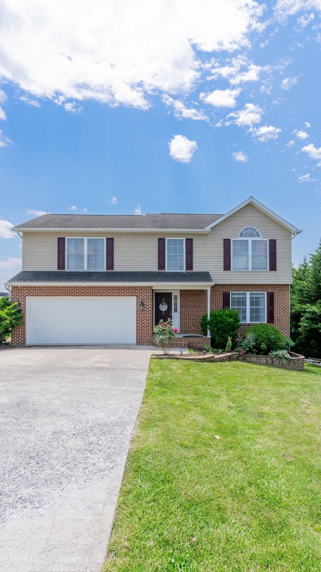 1411 Shenstone Dr, Harrisonburg, VA 22802 - view of front facade featuring brick siding, a garage, and driveway