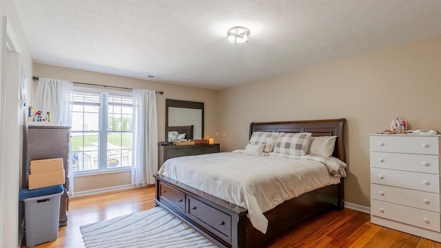 1411 Shenstone Dr, Harrisonburg, VA 22802 - bedroom featuring light wood-style floors and a textured ceiling