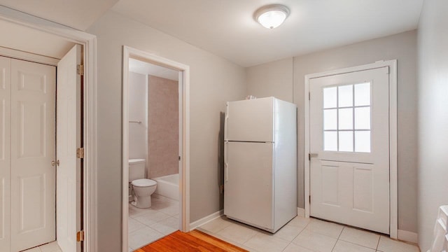 1411 Shenstone Dr, Harrisonburg, VA 22802 - kitchen with freestanding refrigerator and light tile patterned floors