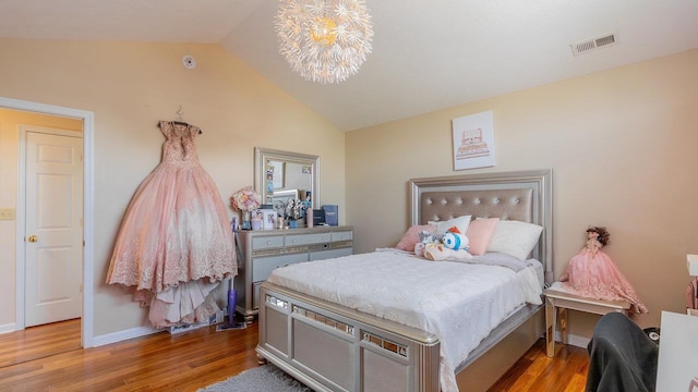 1411 Shenstone Dr, Harrisonburg, VA 22802 - bedroom with lofted ceiling, wood finished floors, and a chandelier