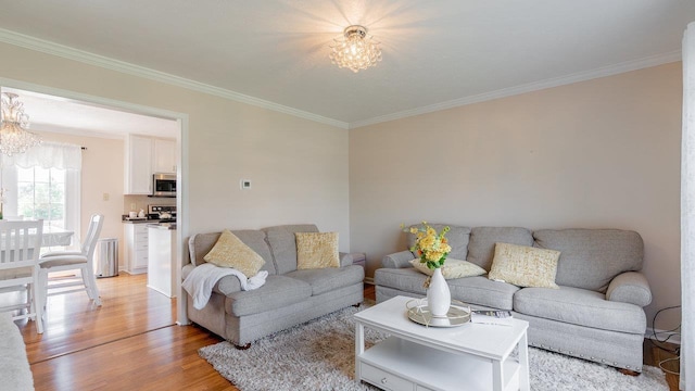 1411 Shenstone Dr, Harrisonburg, VA 22802 - living area with a chandelier, ornamental molding, and light wood-style floors