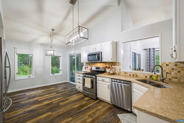 12 Springer Rd, Stuarts Draft, VA 24477 - unfurnished living room with a chandelier, wood finished floors, lofted ceiling, a fireplace with flush hearth, and a ceiling fan