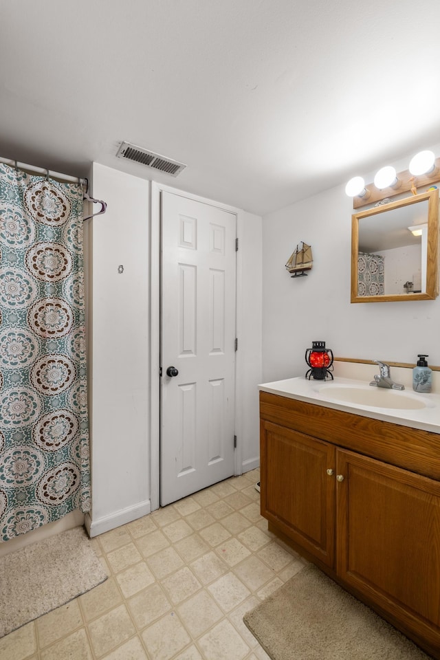 bathroom with vanity and walk in shower