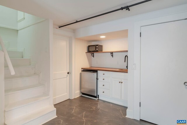 1014 Saint Charles Ave, Charlottesville, VA 22901 - indoor bar with fridge and dark marble finish floors