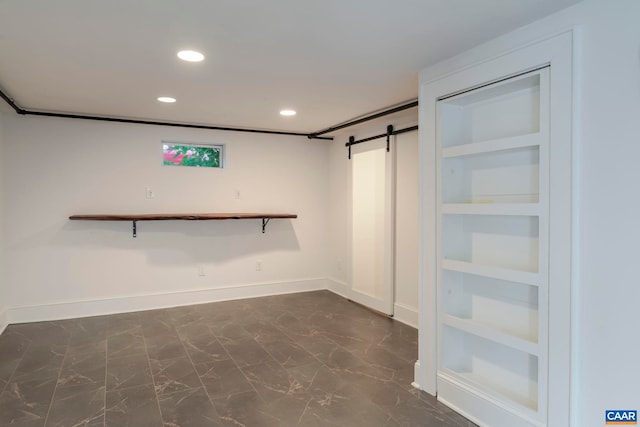1014 Saint Charles Ave, Charlottesville, VA 22901 - walk in closet featuring a barn door and dark marble finish flooring