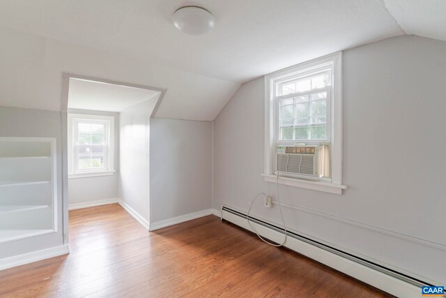 1014 Saint Charles Ave, Charlottesville, VA 22901 - bonus room with a baseboard heating unit, lofted ceiling, wood finished floors, and cooling unit