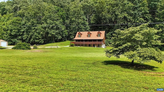 2070 Woodson Rd, Nelson, VA 22967 - view of green lawn with an outbuilding, a forest view, and a garage