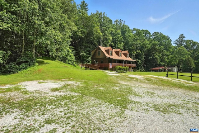 2070 Woodson Rd, Nelson, VA 22967 - view of front facade featuring a front lawn, a deck, and a view of trees