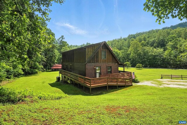 2070 Woodson Rd, Nelson, VA 22967 - rear view of house featuring a forest view, board and batten siding, and a wooden deck