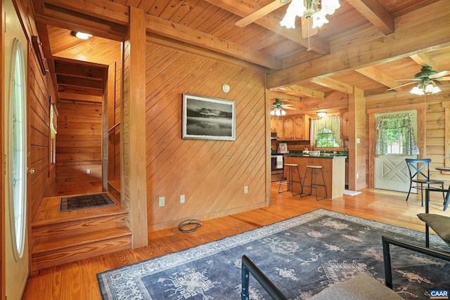 2070 Woodson Rd, Nelson, VA 22967 - living room with a ceiling fan, light wood-style floors, wood walls, and a wood ceiling with exposed beams