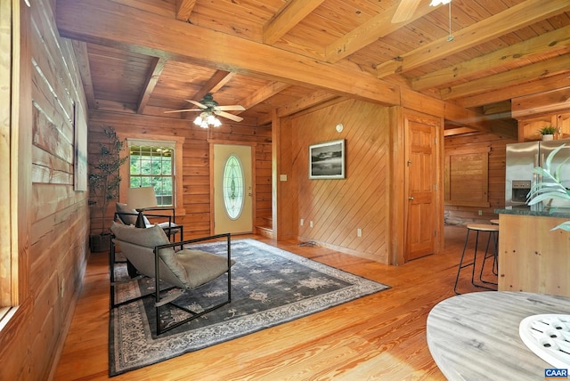 2070 Woodson Rd, Nelson, VA 22967 - living area featuring ceiling fan, wood walls, a wooden ceiling with exposed beams, and light wood finished floors
