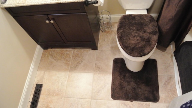 bathroom featuring vanity and toilet