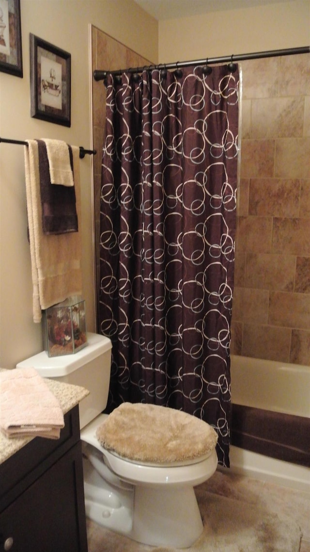 bathroom with vanity, toilet, and shower / tub combo with curtain