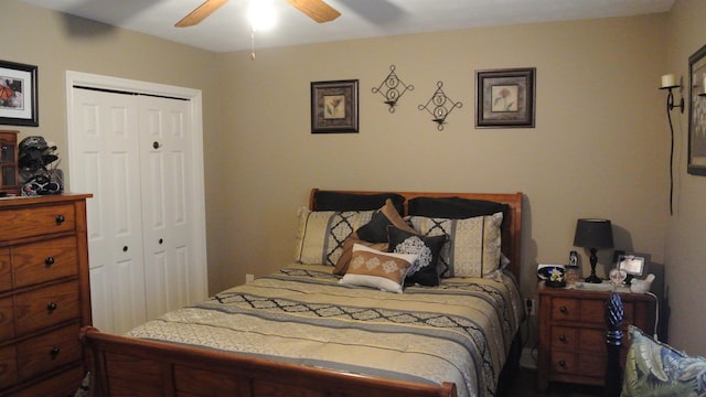 bedroom with ceiling fan and a closet