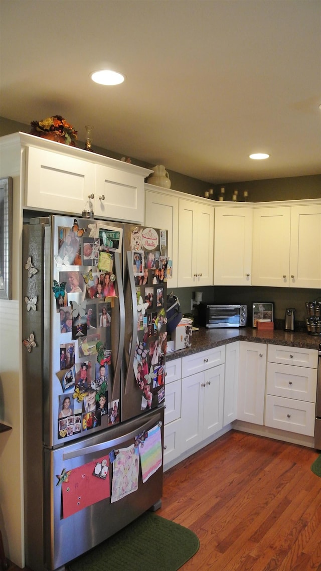 kitchen with light wood-style floors, recessed lighting, white cabinets, and freestanding refrigerator