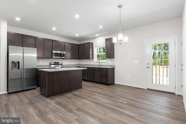 27000 Tatum Rd, Unionville, VA 22567 - kitchen featuring appliances with stainless steel finishes, dark brown cabinetry, healthy amount of natural light, wood finished floors, and recessed lighting