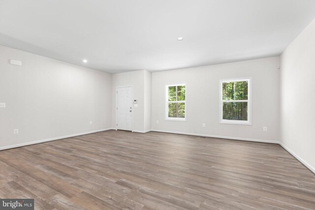 27000 Tatum Rd, Unionville, VA 22567 - spare room featuring wood finished floors, baseboards, and recessed lighting