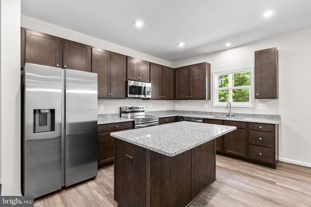 27000 Tatum Rd, Unionville, VA 22567 - kitchen featuring appliances with stainless steel finishes, a sink, dark brown cabinetry, light wood-style flooring, and recessed lighting