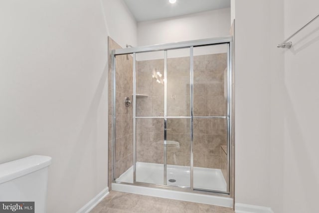 27000 Tatum Rd, Unionville, VA 22567 - bathroom featuring toilet, a stall shower, baseboards, and tile patterned floors
