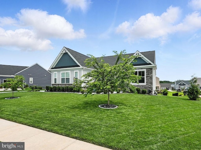 11708 Robin Woods Cir, Spotsylvania, VA 22551 - view of front of property with stone siding, board and batten siding, and a front lawn