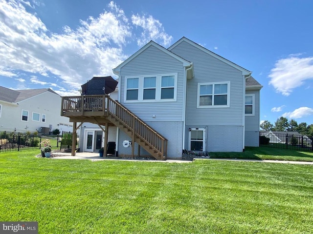 11708 Robin Woods Cir, Spotsylvania, VA 22551 - back of house featuring stairs, a patio area, a wooden deck, and brick siding