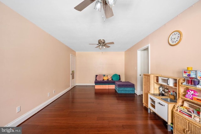 12203 Abner Ct, Fredericksburg, VA 22407 - playroom featuring ceiling fan, dark wood finished floors, and baseboards