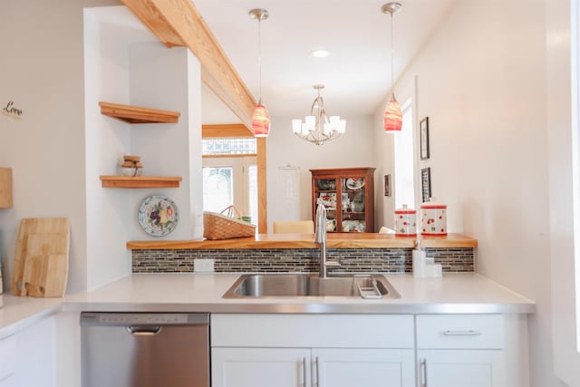 kitchen featuring a sink, open shelves, stainless steel dishwasher, decorative light fixtures, and a chandelier