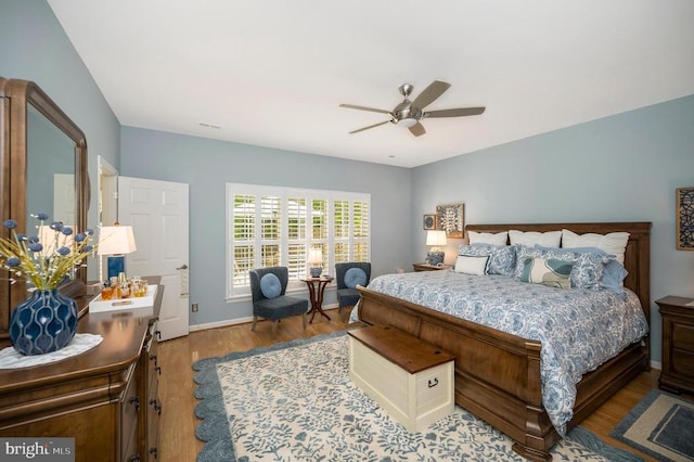 9404 Dalmahoy Ln, Fredericksburg, VA 22408 - bedroom with wood finished floors, baseboards, and a ceiling fan