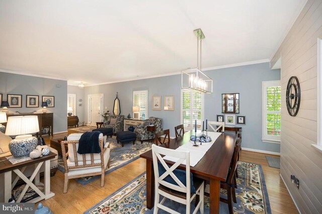 9404 Dalmahoy Ln, Fredericksburg, VA 22408 - dining room with a chandelier, wood finished floors, ornamental molding, and baseboards
