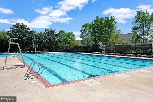 9404 Dalmahoy Ln, Fredericksburg, VA 22408 - community pool with fence and a patio area