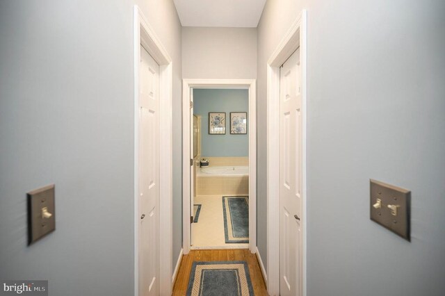 9404 Dalmahoy Ln, Fredericksburg, VA 22408 - hallway with wood finished floors and baseboards