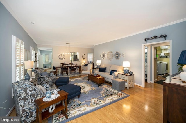 9404 Dalmahoy Ln, Fredericksburg, VA 22408 - living room with crown molding, wood finished floors, a chandelier, and baseboards