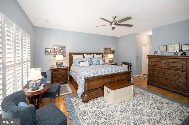 9404 Dalmahoy Ln, Fredericksburg, VA 22408 - bedroom with wood finished floors, baseboards, and a ceiling fan