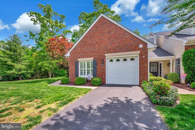 9404 Dalmahoy Ln, Fredericksburg, VA 22408 - traditional-style home featuring brick siding, a garage, driveway, and a front yard