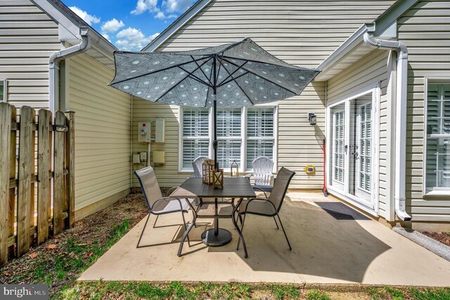 9404 Dalmahoy Ln, Fredericksburg, VA 22408 - view of patio featuring outdoor dining space and fence