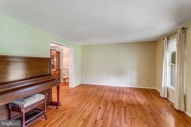 - living area with light wood-style flooring