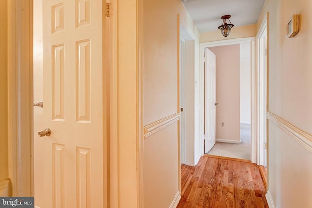  - hallway with wood finished floors