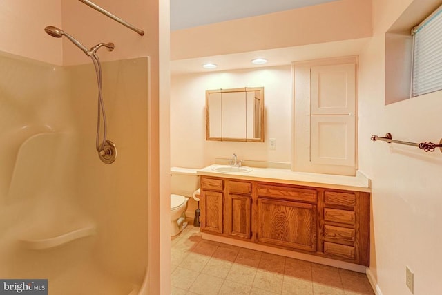  - bathroom featuring a shower, vanity, tile patterned flooring, and recessed lighting