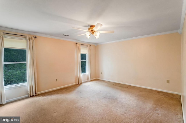  - carpeted spare room featuring ornamental molding and ceiling fan